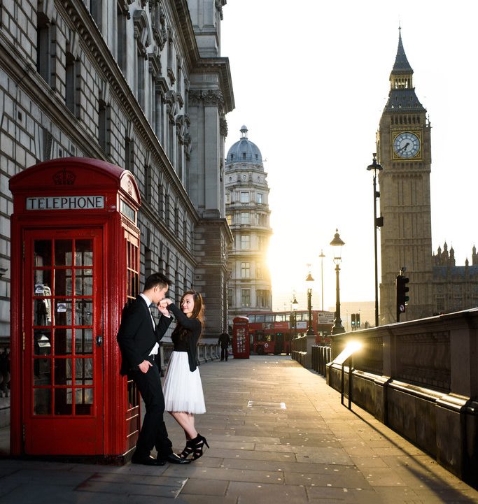 Bride & groom outside a red telephone box near Westminster, London