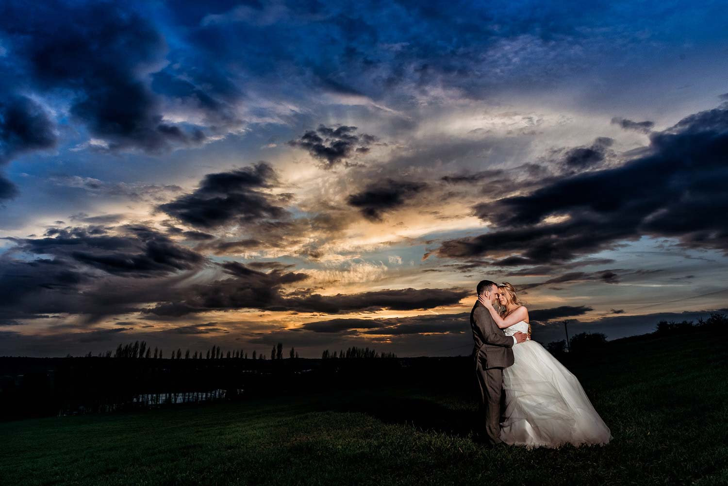 Sunset Wedding Photo at Swancar Farm taken in the field behind this stunning venue