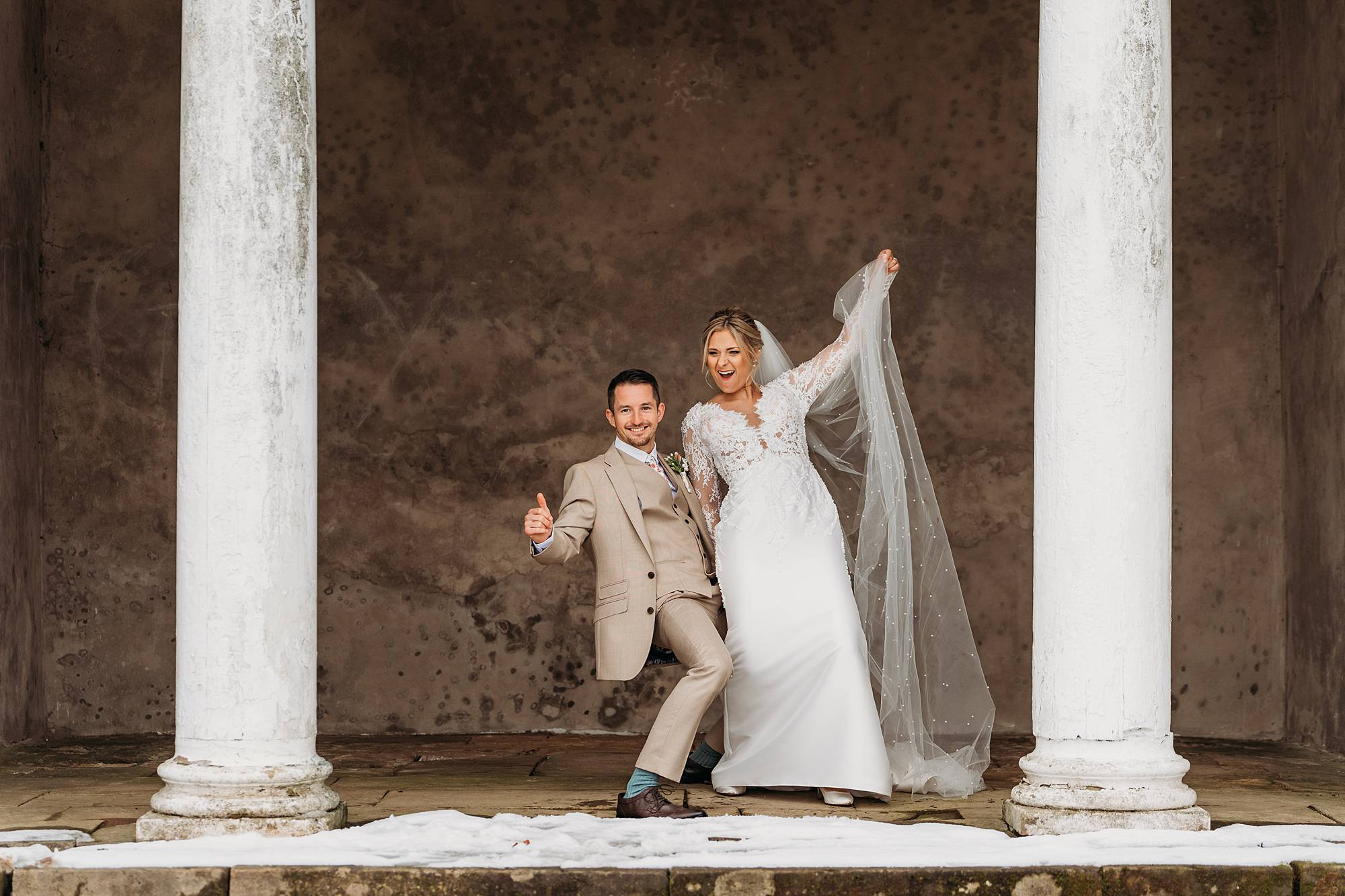Bride and groom dancing happily at Norwood Park after their wedding
