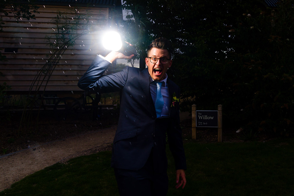 A groomsman holding the AD200