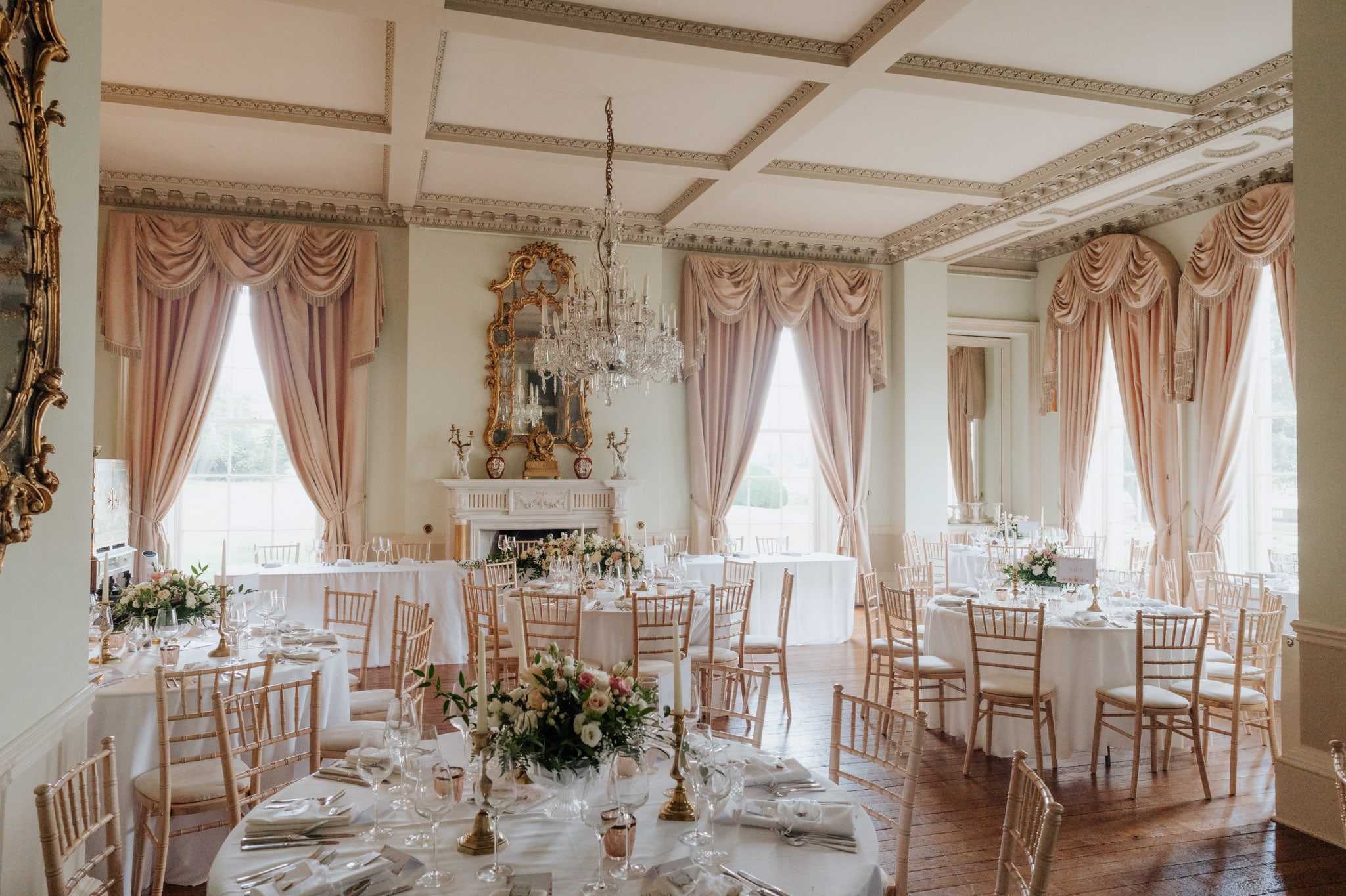 Dining room at Prestwold Hall set up with round tables for a wedding breakfast