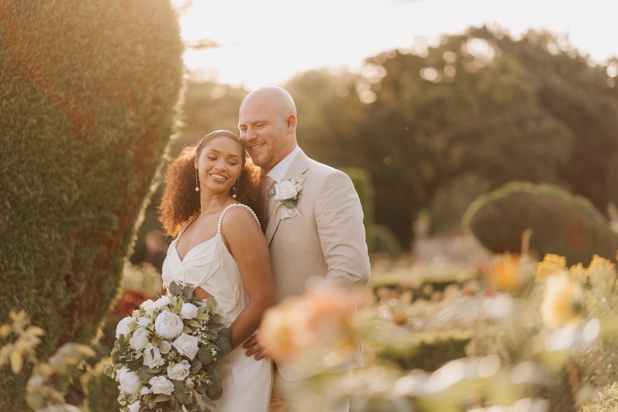 Golden hour portrait with bride & groom in the rose gardens at Prestwold Hall