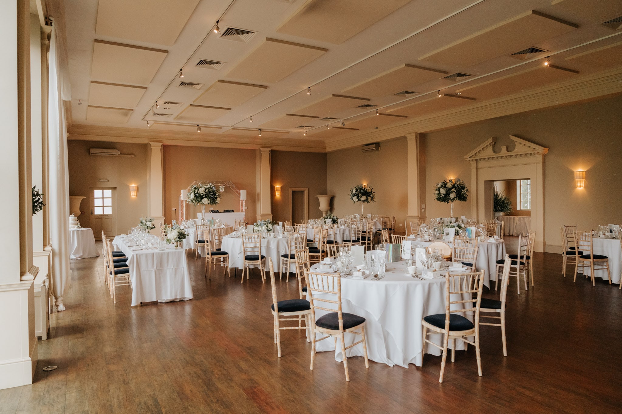 Orangery room at Stubton Hall set up for a wedding breakfast with round tables