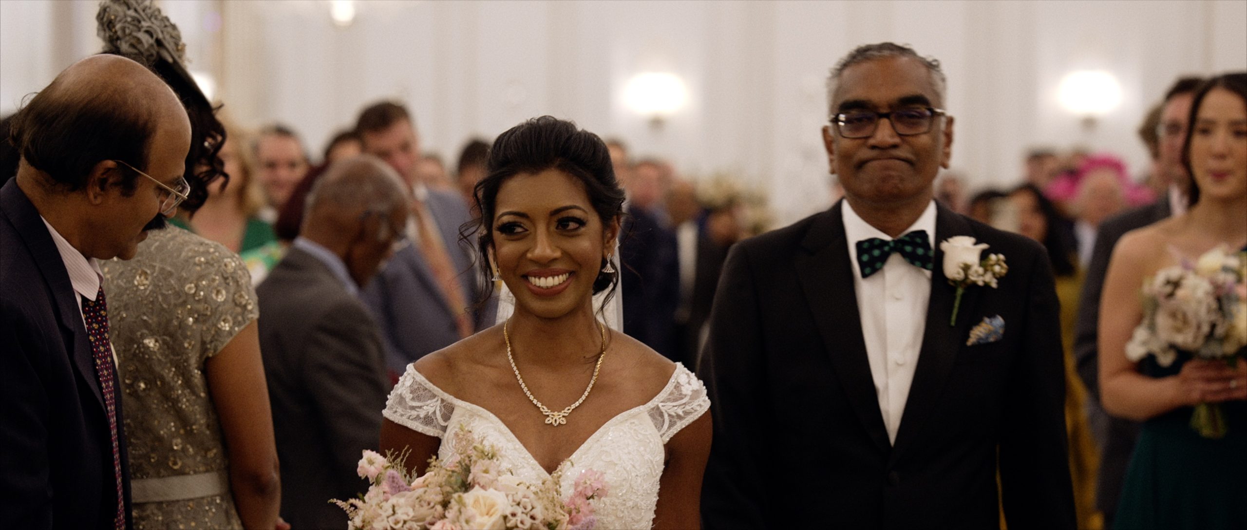 Bride walking down the aisle with her dad at Claridge's wedding